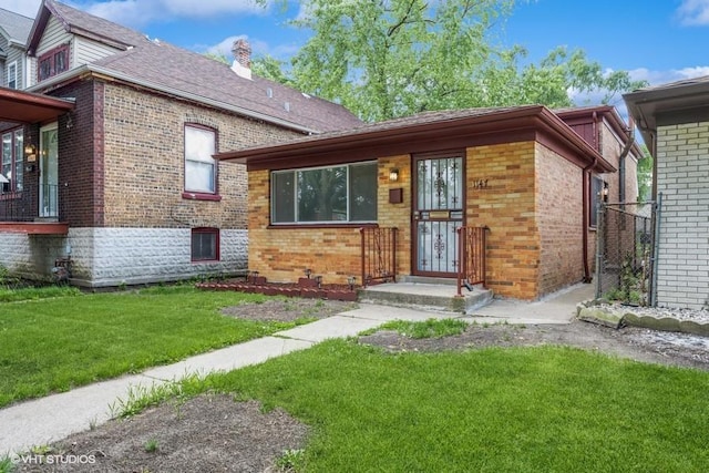 1147 E 91st St, Chicago, IL 60638 - view of front of home with brick siding, a front yard, and a chimney