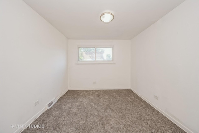 1147 E 91st St, Chicago, IL 60638 - empty room with carpet flooring and baseboards