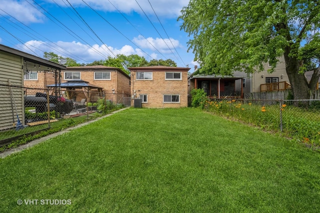 1147 E 91st St, Chicago, IL 60638 - rear view of house with a gazebo, a fenced backyard, and brick siding