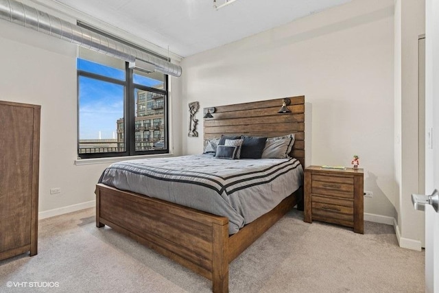 212 E Cullerton St Unit 702, Chicago, IL 60616 - carpeted bedroom featuring baseboards