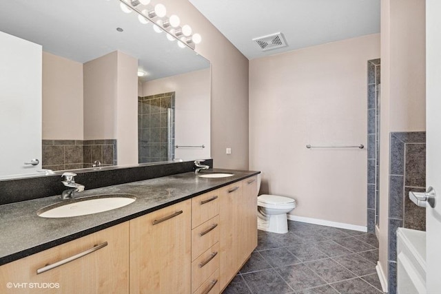 212 E Cullerton St Unit 702, Chicago, IL 60616 - bathroom featuring double vanity, tile patterned flooring, and a tile shower