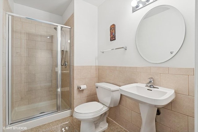 212 E Cullerton St Unit 702, Chicago, IL 60616 - full bathroom featuring tile walls, a stall shower, and a wainscoted wall