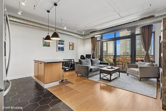 212 E Cullerton St Unit 702, Chicago, IL 60616 - living area featuring rail lighting and dark tile patterned flooring