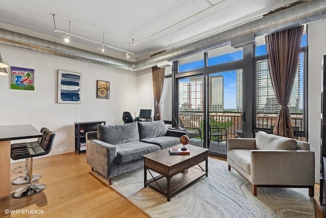 212 E Cullerton St Unit 702, Chicago, IL 60616 - living room with light wood-style flooring and baseboards