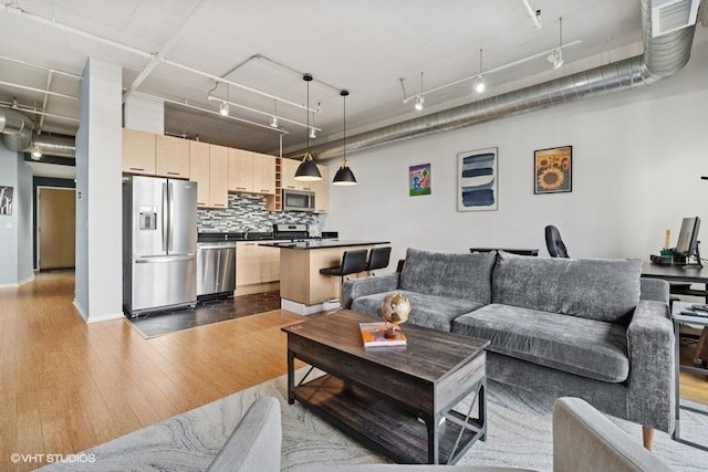 212 E Cullerton St Unit 702, Chicago, IL 60616 - living room featuring dark wood-style flooring and track lighting