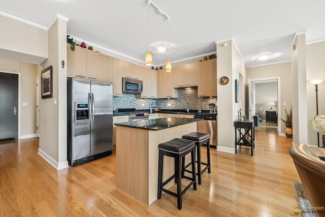225 N Columbus Dr Unit 6808, Chicago, IL 60601 - kitchen with stainless steel appliances, ornamental molding, a breakfast bar area, a center island, and light wood-type flooring