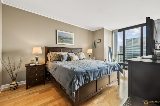 225 N Columbus Dr Unit 6808, Chicago, IL 60601 - bedroom with ornamental molding, floor to ceiling windows, and light wood-style floors