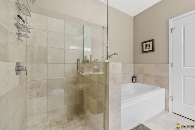 225 N Columbus Dr Unit 6808, Chicago, IL 60601 - full bathroom with a stall shower, a garden tub, and tile patterned floors