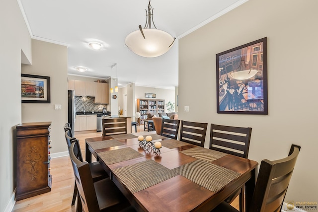 225 N Columbus Dr Unit 6808, Chicago, IL 60601 - dining space with light wood-style floors and crown molding