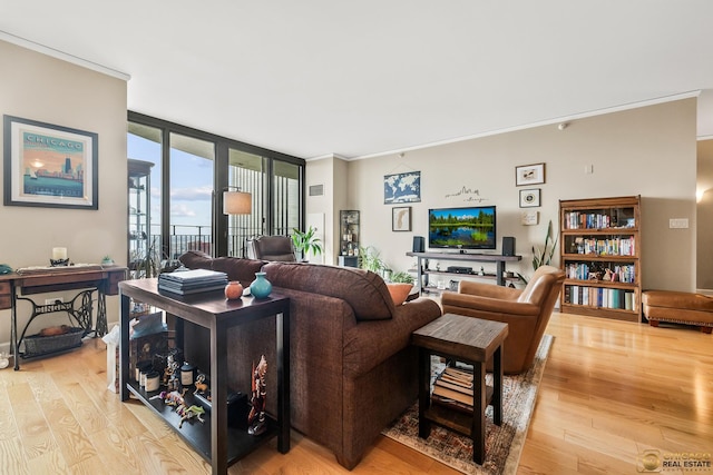 225 N Columbus Dr Unit 6808, Chicago, IL 60601 - living room featuring light wood finished floors, crown molding, and a wall of windows