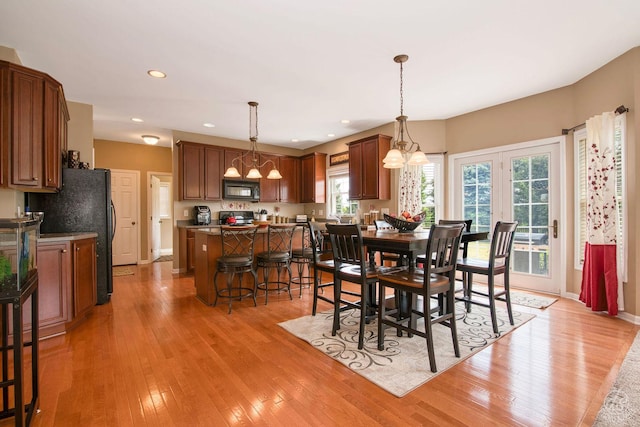 414 Alden Dr, Sycamore, IL 60178 - dining area featuring light wood finished floors, a chandelier, and recessed lighting