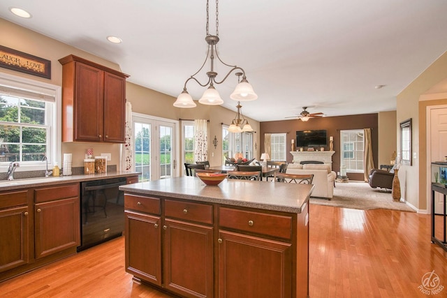 414 Alden Dr, Sycamore, IL 60178 - kitchen with dishwasher, a fireplace, a kitchen island, recessed lighting, and light wood-style flooring