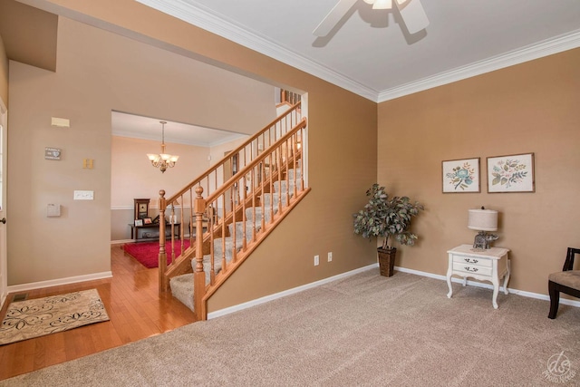 414 Alden Dr, Sycamore, IL 60178 - staircase with crown molding, a ceiling fan, carpet flooring, and a chandelier