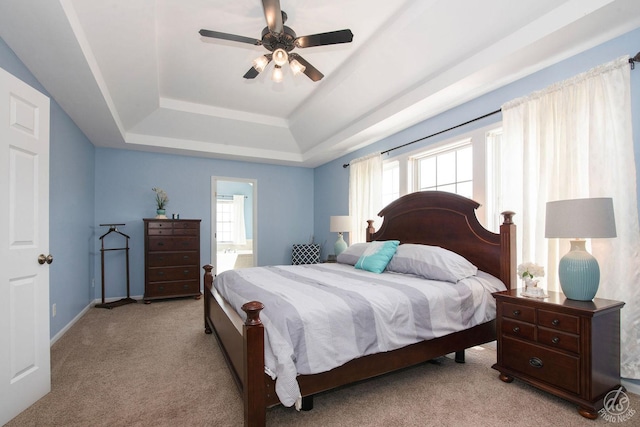 414 Alden Dr, Sycamore, IL 60178 - bedroom with a raised ceiling, light colored carpet, ensuite bath, and ceiling fan