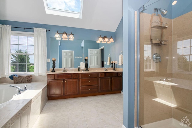 414 Alden Dr, Sycamore, IL 60178 - full bath with a bath, a stall shower, tile patterned floors, double vanity, and a skylight