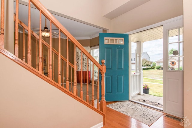 414 Alden Dr, Sycamore, IL 60178 - foyer entrance featuring stairway, wood finished floors, and crown molding