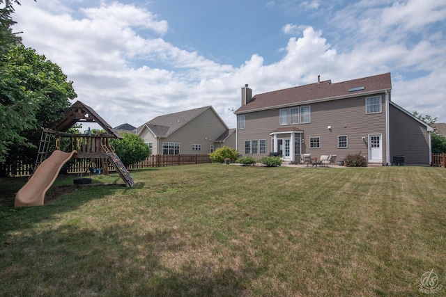 414 Alden Dr, Sycamore, IL 60178 - back of house featuring a playground, a chimney, a patio, and entry steps