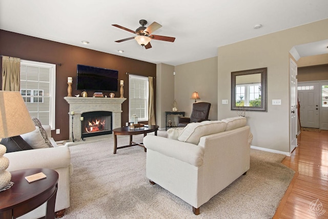 414 Alden Dr, Sycamore, IL 60178 - living area featuring light wood finished floors, a ceiling fan, a warm lit fireplace, and recessed lighting