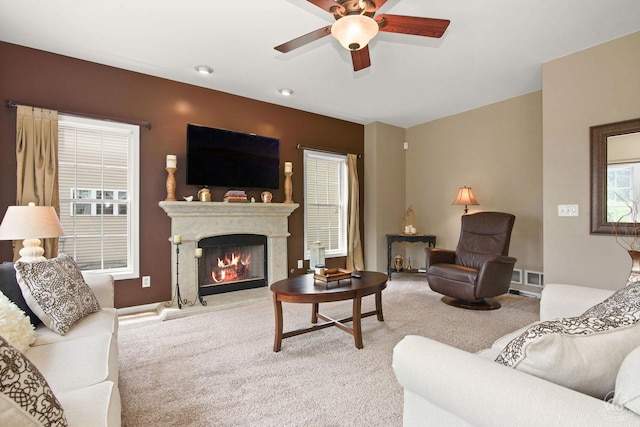 414 Alden Dr, Sycamore, IL 60178 - living room with carpet, a ceiling fan, and a high end fireplace