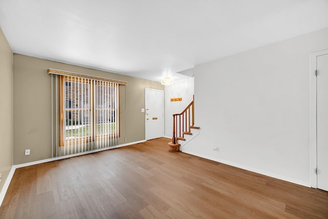 1746 Sessions Walk Unit 1746, Hoffman Estates, IL 60169 - spare room with wood finished floors and stairs