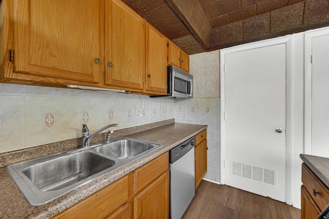 1746 Sessions Walk Unit 1746, Hoffman Estates, IL 60169 - kitchen with stainless steel appliances, dark wood-style flooring, brown cabinetry, tile walls, and backsplash