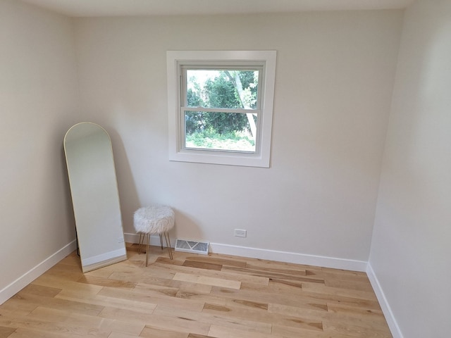 5841 Sunrise Ave, Clarendon Hills, IL 60514 - empty room with light wood-style flooring and baseboards