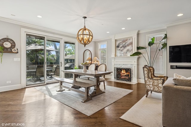 725 Park Plaine Ave, Park Ridge, IL 60068 - dining space featuring ornamental molding, wood finished floors, a chandelier, a fireplace, and recessed lighting