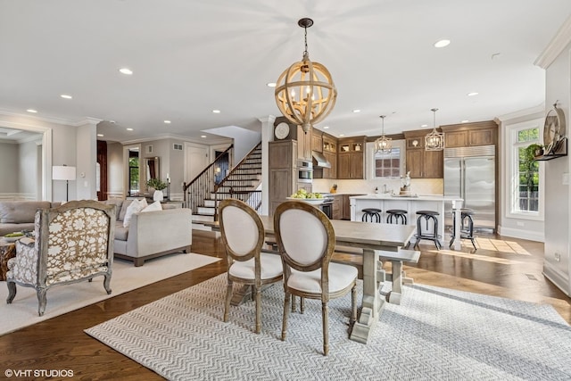 725 Park Plaine Ave, Park Ridge, IL 60068 - dining area featuring recessed lighting, a chandelier, stairs, ornamental molding, and wood finished floors
