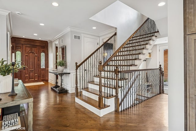 725 Park Plaine Ave, Park Ridge, IL 60068 - entrance foyer featuring wood finished floors, recessed lighting, ornamental molding, stairs, and a decorative wall