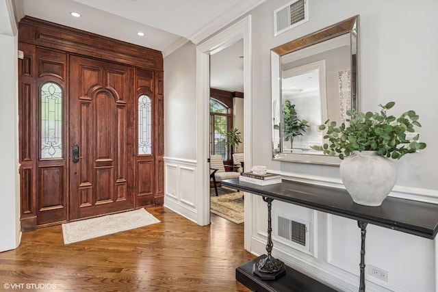 725 Park Plaine Ave, Park Ridge, IL 60068 - foyer entrance with dark wood-type flooring, a wainscoted wall, recessed lighting, ornamental molding, and a decorative wall