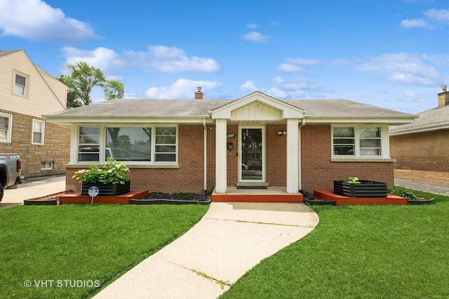 5813 Superior St, Berkeley, IL 60163 - view of front of home featuring brick siding, a front yard, and a shingled roof