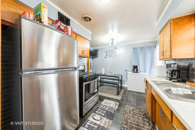 5813 Superior St, Berkeley, IL 60163 - kitchen featuring appliances with stainless steel finishes, light countertops, brown cabinets, ornamental molding, and tasteful backsplash