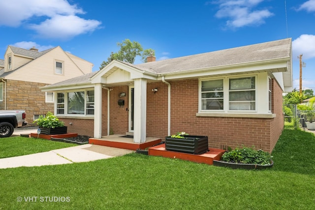 5813 Superior St, Berkeley, IL 60163 - bungalow-style house featuring brick siding, a front yard, and a chimney