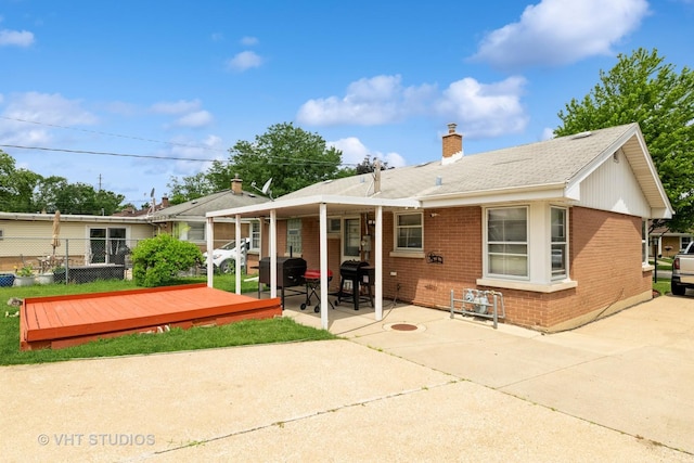 5813 Superior St, Berkeley, IL 60163 - rear view of house with brick siding, a chimney, a patio area, and a wooden deck