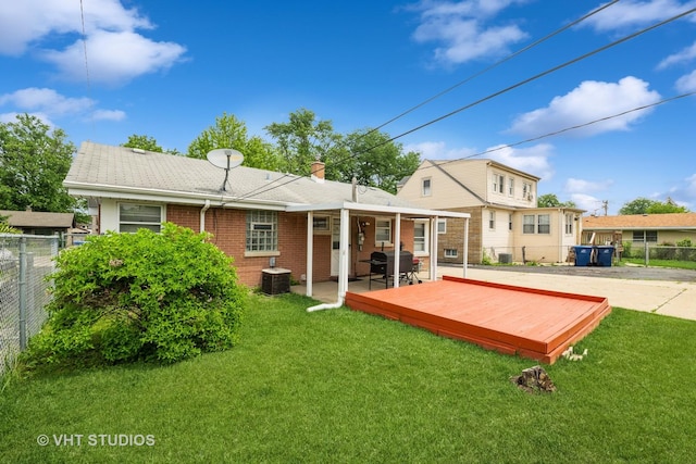 5813 Superior St, Berkeley, IL 60163 - back of house featuring a wooden deck, brick siding, and a chimney