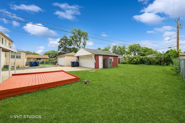 5813 Superior St, Berkeley, IL 60163 - view of yard with a garage, an outbuilding, and a wooden deck