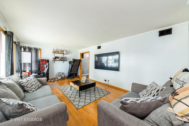 5813 Superior St, Berkeley, IL 60163 - living room featuring wood finished floors and ornamental molding