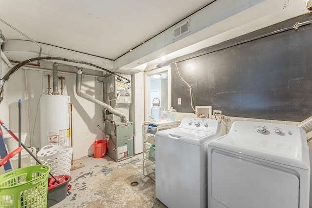 189 Westwood Dr, Park Forest, IL 60466 - laundry area with washing machine and clothes dryer, water heater, and heating unit