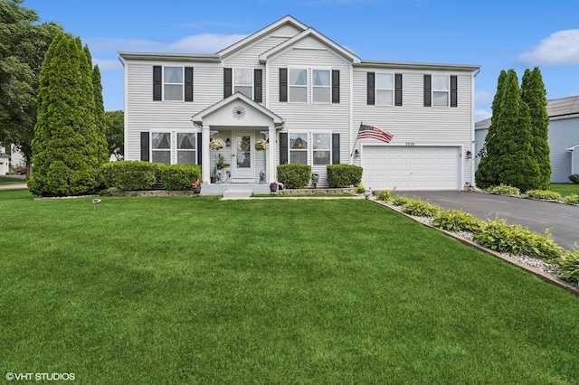 2930 Plumrose Ln, Mchenry, IL 60050 - view of front of house featuring an attached garage, driveway, and a front lawn