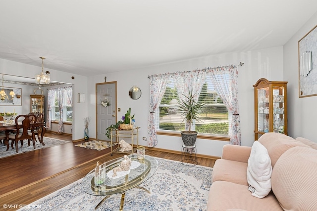 2930 Plumrose Ln, Mchenry, IL 60050 - living room featuring wood finished floors, plenty of natural light, and a chandelier