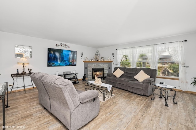 2930 Plumrose Ln, Mchenry, IL 60050 - living room featuring a tiled fireplace and light wood finished floors
