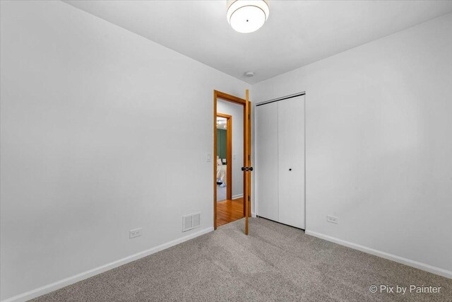 1422 Ridgeway St, Round Lake Beach, IL 60073 - unfurnished bedroom featuring carpet flooring and a closet