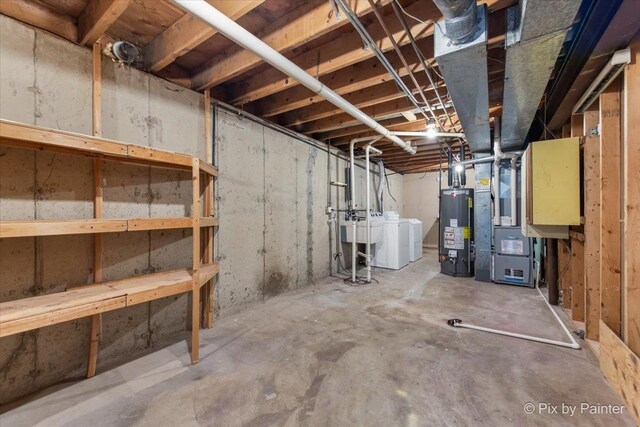 1422 Ridgeway St, Round Lake Beach, IL 60073 - unfinished basement featuring gas water heater, heating unit, and washer and dryer