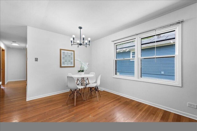 1422 Ridgeway St, Round Lake Beach, IL 60073 - dining area featuring a chandelier and wood finished floors