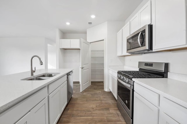 14632 S Azalia Cir, Plainfield, IL 60544 - kitchen with stainless steel appliances, white cabinets, dark wood-style floors, and recessed lighting