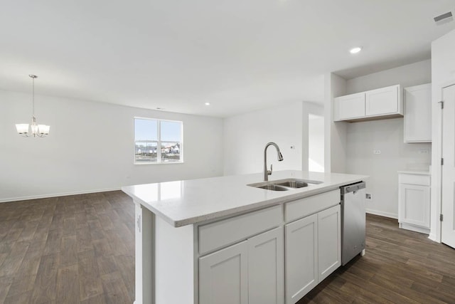 14632 S Azalia Cir, Plainfield, IL 60544 - kitchen with stainless steel dishwasher, dark wood finished floors, white cabinetry, a chandelier, and a center island with sink