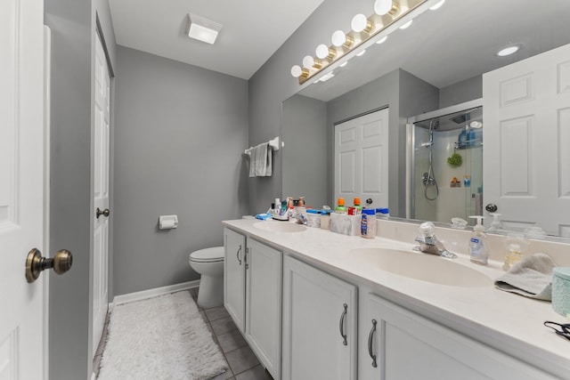 59 Colonial Ct, Streamwood, IL 60107 - bathroom with double vanity, a shower stall, and tile patterned flooring