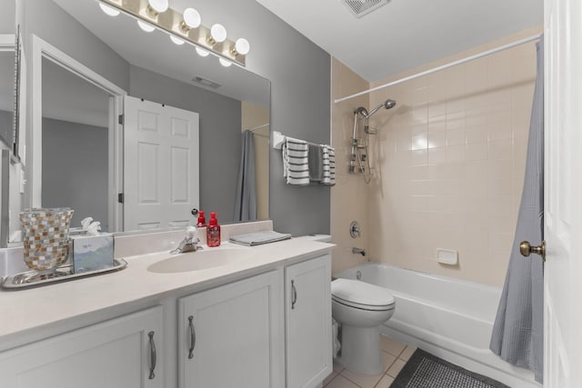 59 Colonial Ct, Streamwood, IL 60107 - bathroom with tile patterned floors, vanity, and shower / bath combo