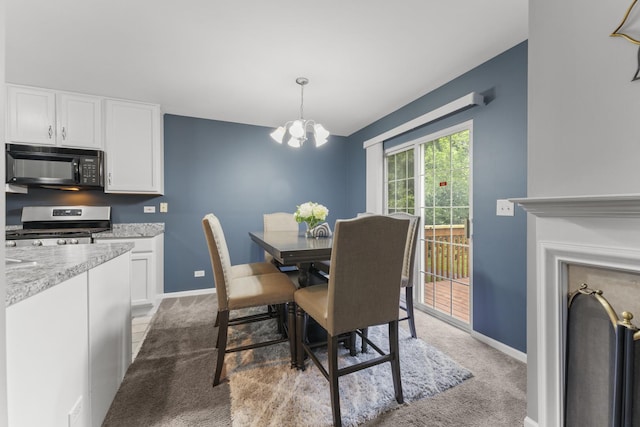 59 Colonial Ct, Streamwood, IL 60107 - dining area featuring light colored carpet and a chandelier
