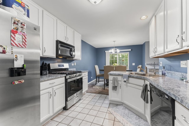 59 Colonial Ct, Streamwood, IL 60107 - kitchen featuring black appliances, white cabinetry, light tile patterned flooring, light countertops, and recessed lighting